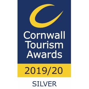 Logo of the Cornwall Tourism Awards 2019/20 featuring a crescent moon on a navy blue background, with text and a silver banner indicating a silver award.