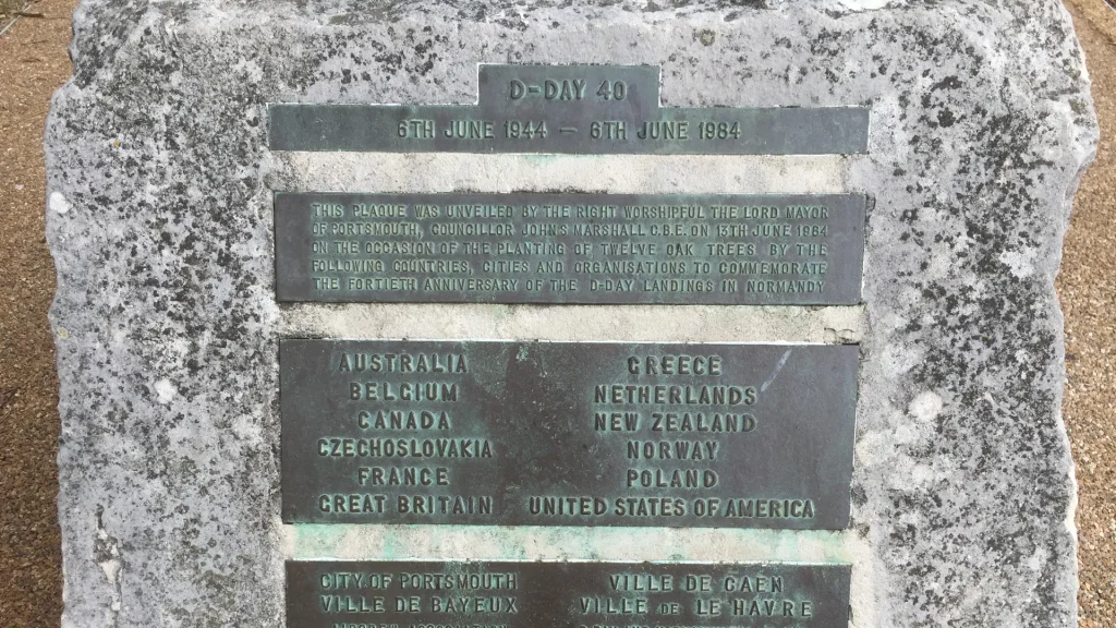 Commemorative plaque for the 40th anniversary of d-day from june 6, 1944 to june 6, 1984. lists eleven participating countries and the villages of banneville and bavent in normandy.