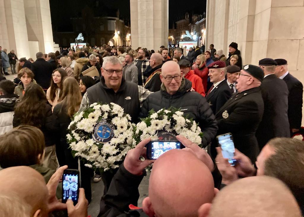 Ian with clients with wreaths at war memorial